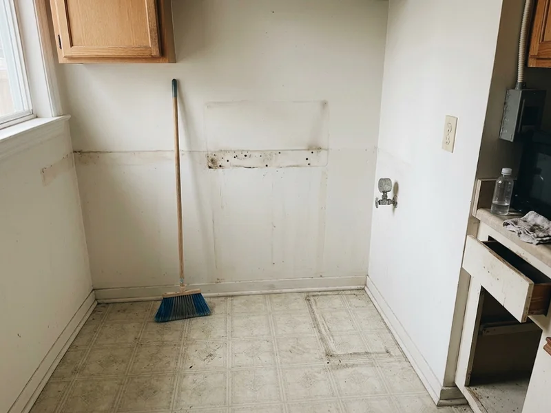 Empty kitchen alcove after appliance removal
