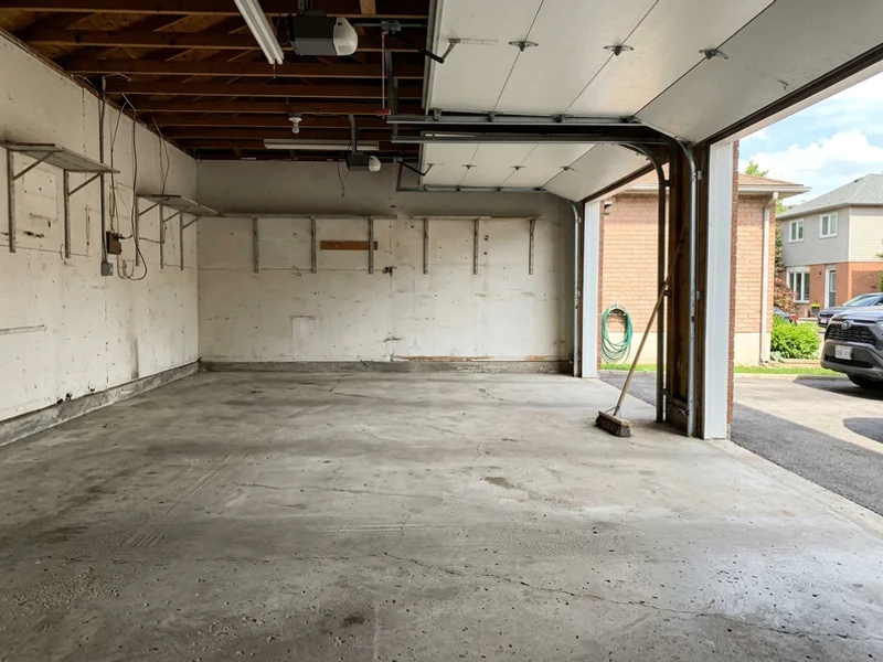 The same garage empty and swept after the job